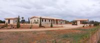 General view with outbuildings and forecourt